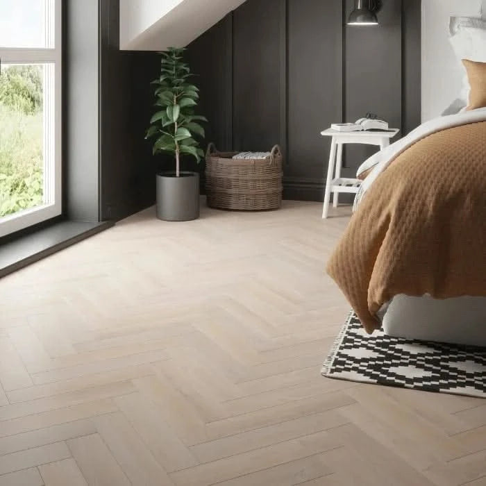 Завантажте зображення в засіб перегляду галереї, larissa oak herringbone laminate flooring on display in a bedroom