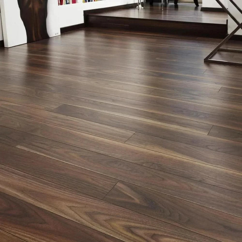 Завантажте зображення в засіб перегляду галереї, dark walnut laminate flooring on display in a home setting