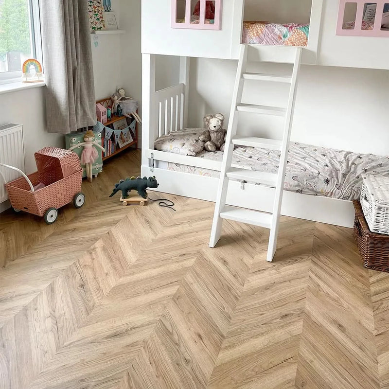 Załaduj obraz do przeglądarki galerii, dark rillington oak laminate flooring on display in a bedroom in a chevron pattern