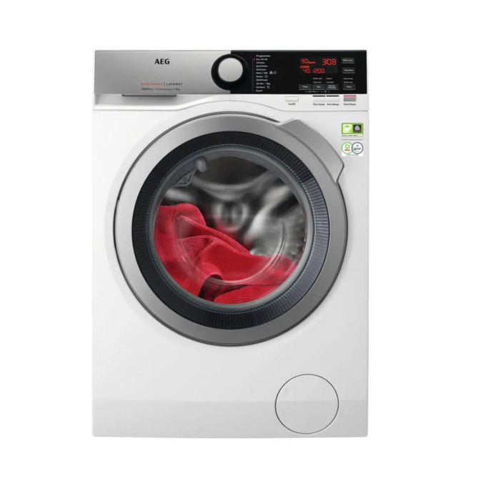 white washing machine with silver and black ribbed door