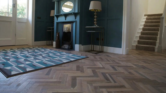 white oak tumbled herringbone solid wood flooring displayed in a hallway