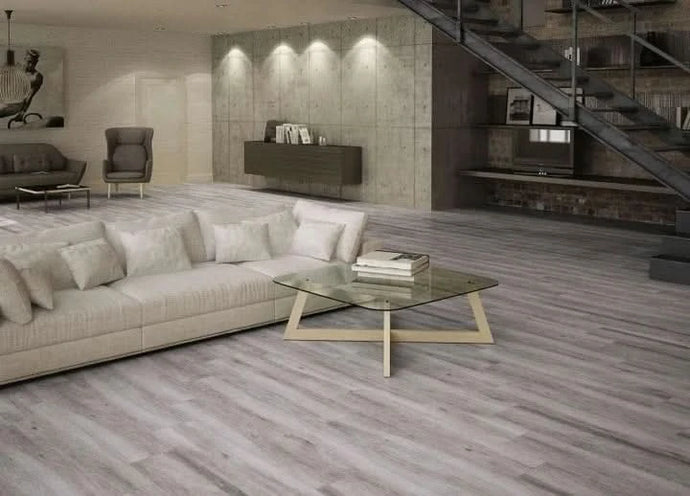 gris atelier tile 23.3x120cm displayed in a living area