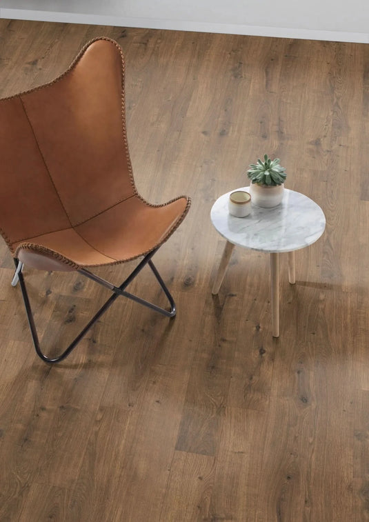 dark dunnington oak aqua laminate flooring on display in a home setting