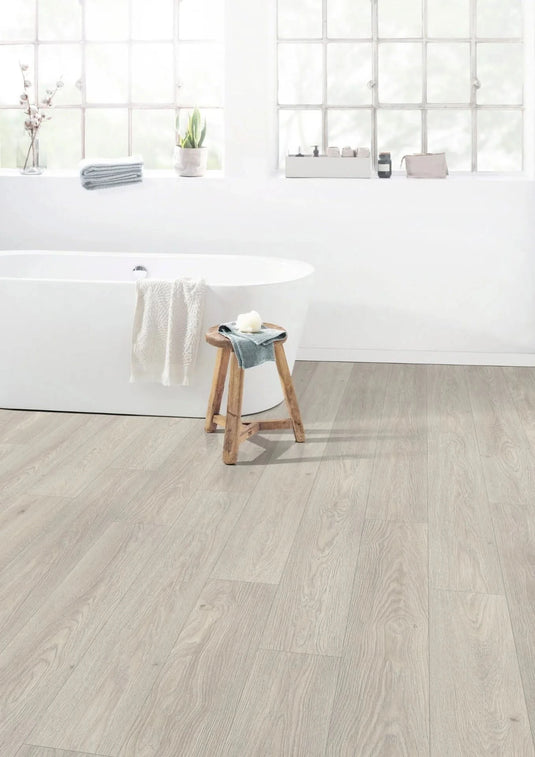 cesena oak white aqua laminate flooring on display in a bathroom