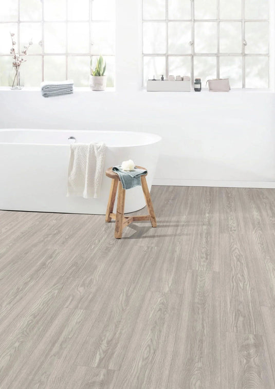 light grey soria oak aqua laminate flooring on display in a bathroom