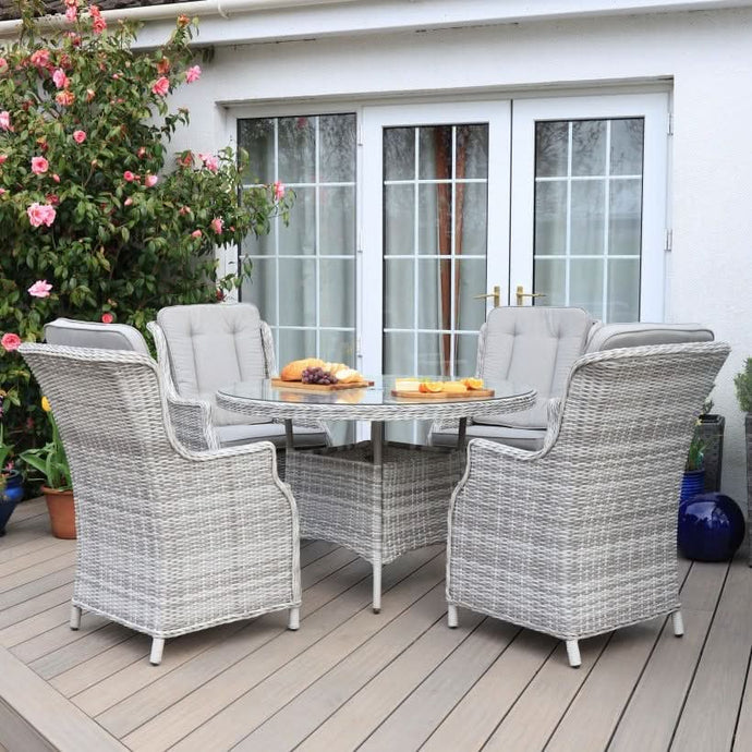white washed 4 seater round set with glass topped table