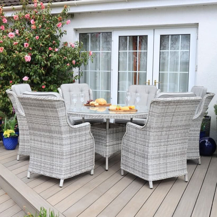 white washed 6 seater round set with glass topped table