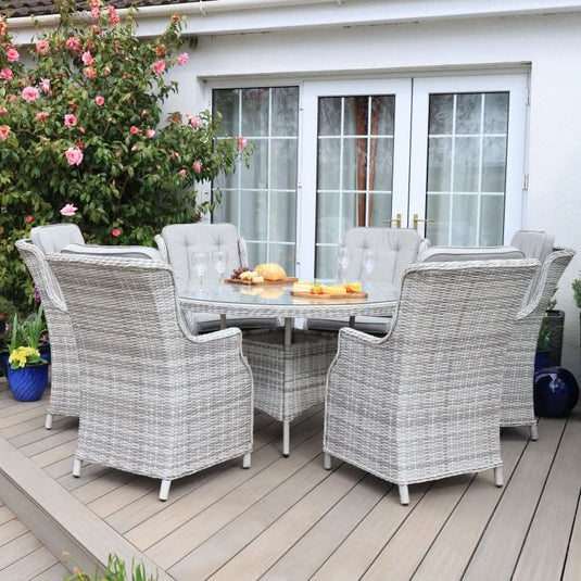 white washed 6 seater round set with glass topped table
