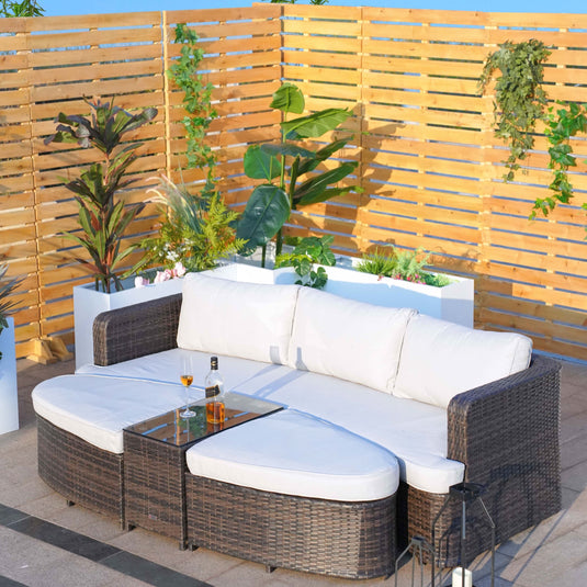 sofa set with 2 ottomans and a glass topped rectangular table in a natural colour
