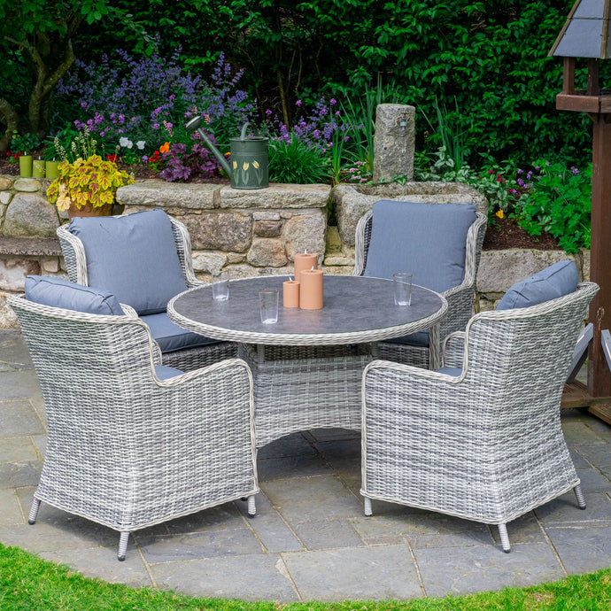 light grey 4 seater deluxe dining set with dark grey cushions and a round table