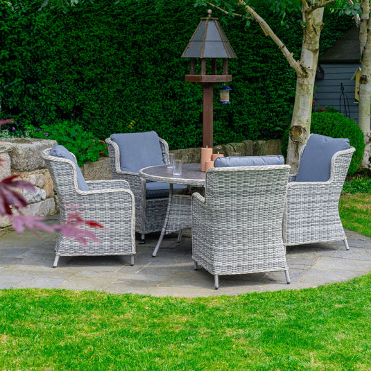 light grey 4 seater deluxe dining set with dark grey cushions and a round table