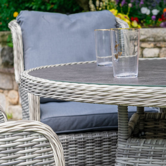 light grey round table with ceramic printed glass top