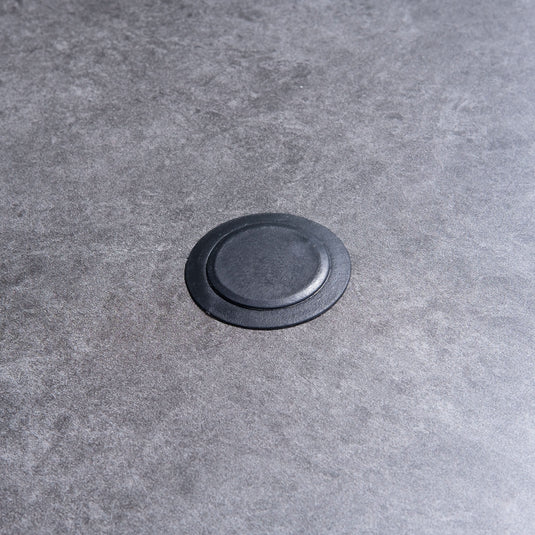 hole for parasol centrally situated within the round table