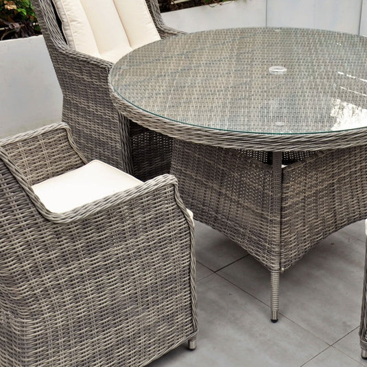 grey glass topped round table (120cm) with hole for parasol centrally situated within the table 