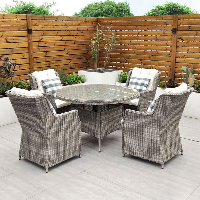 grey 4 seat set with 120cm glass topped round table and cream cushions