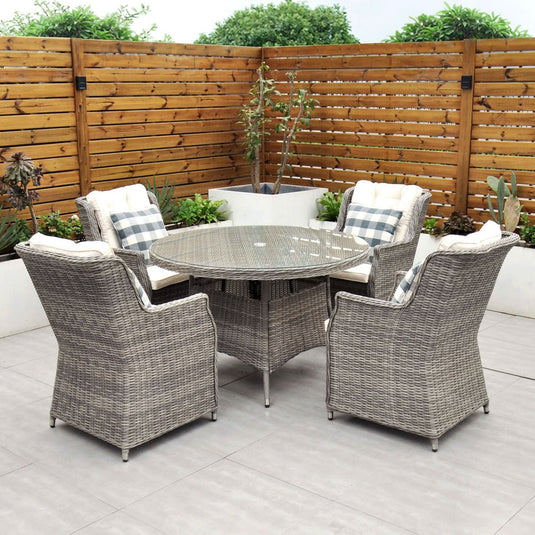 grey 4 seat set with 120cm glass topped round table and cream cushions