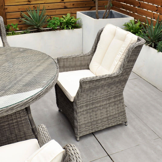 grey curved armchair with cream back and base cushions