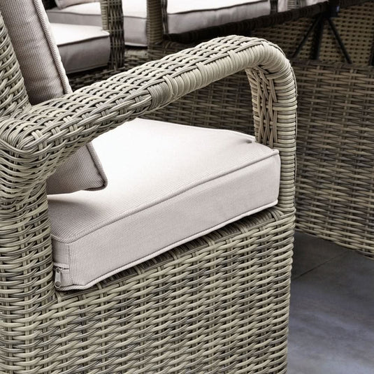 brown woven synthetic rattan armchair with beige base and back cushions