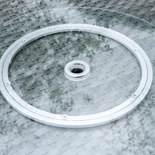 glass topped round table with parasol feature
