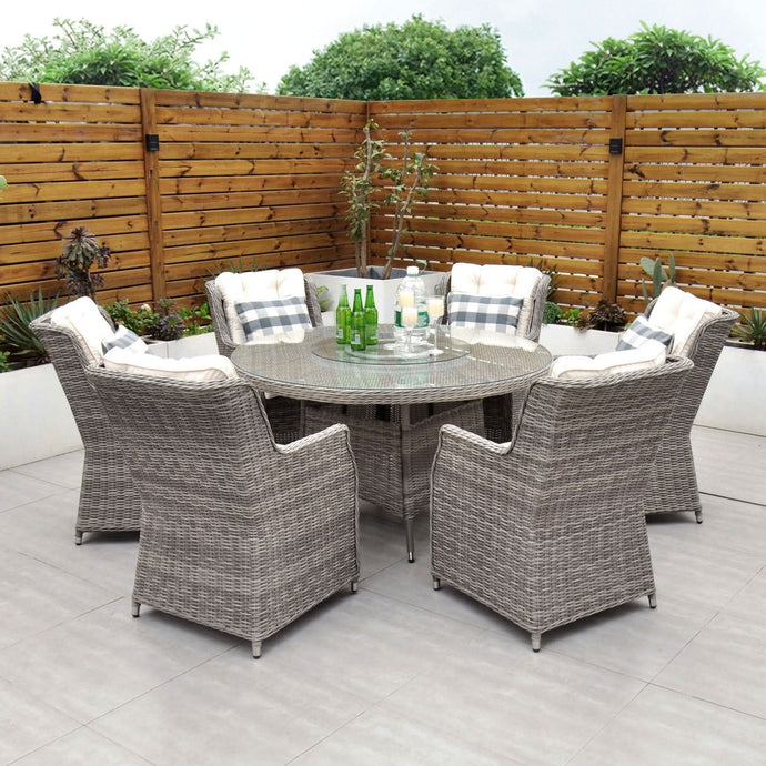grey 6 seat set with 135cm glass topped round table and cream cushions