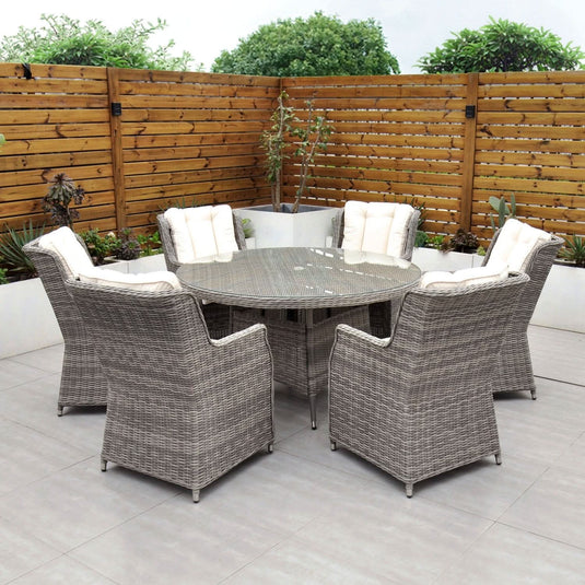 grey 6 seat set with 135cm glass topped round table and cream cushions
