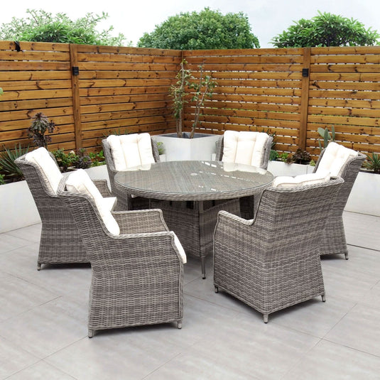 grey 6 seat set with 135cm glass topped round table and cream cushions