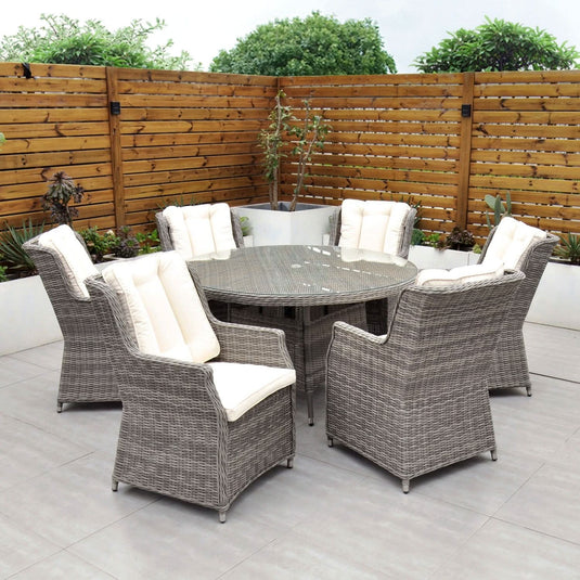 grey 6 seat set with 135cm glass topped round table and cream cushions