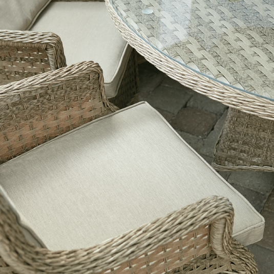 armchair in a natural colour with sand colour back and base cushions