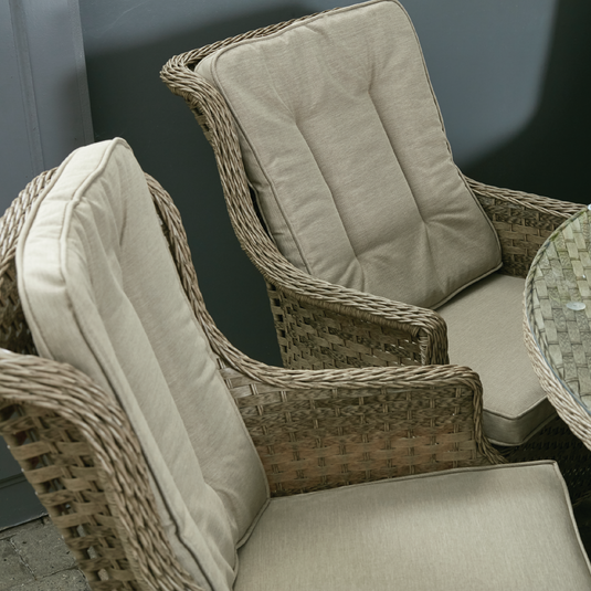 armchairs in a natural colour with sand coloured back and base cushions