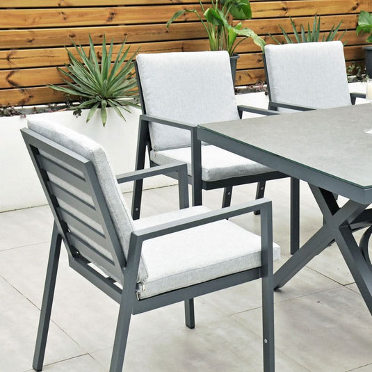 dark grey chairs with cushions and rectangular table