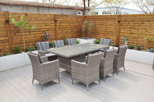 grey 8 seater set with glass topped rectangular table and dark grey cushions 